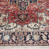 Close-up of an intricately designed Persian Wool Rug with decorative patterns in red, blue, and beige tones.