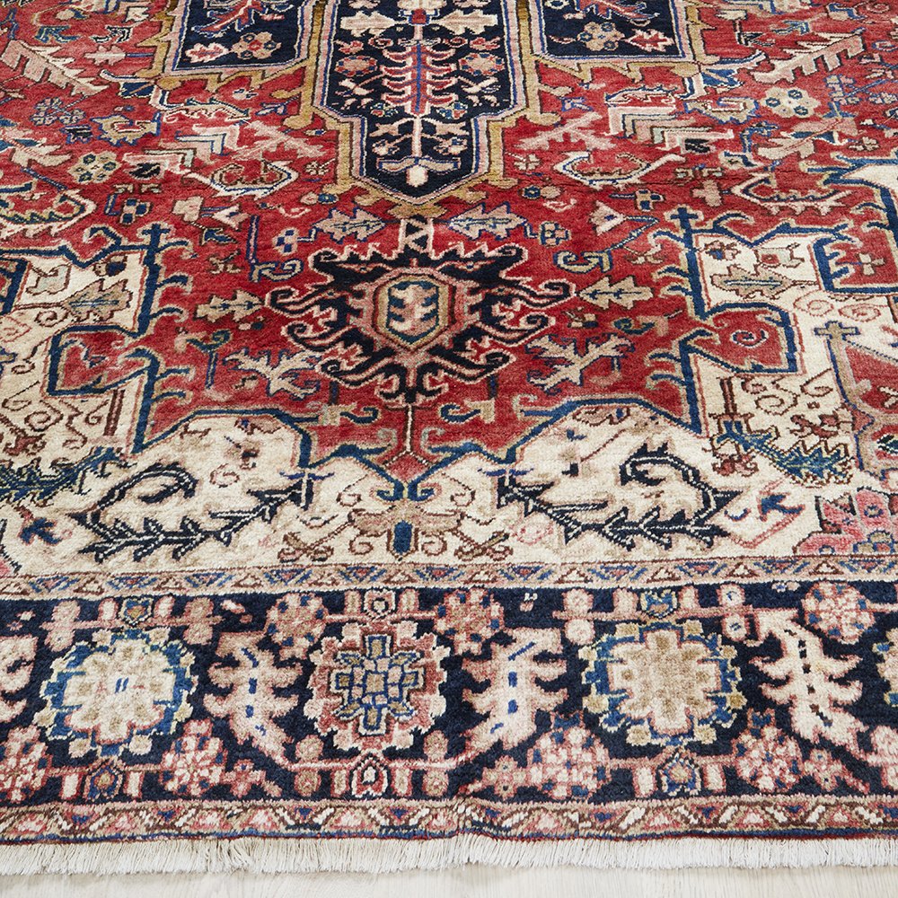 Close-up of an intricately designed Persian Wool Rug with decorative patterns in red, blue, and beige tones.