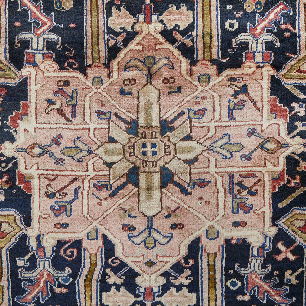 Close-up of an intricately designed Persian wool rug with geometric patterns