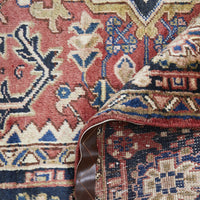 Close-up of a patterned Persian wool rug with intricate designs.