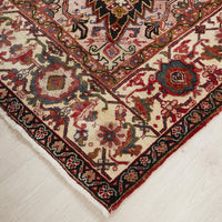 Close-up of a patterned Persian wool rug with intricate designs