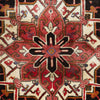 Close-up of a patterned Persian wool rug with red, black, and beige colours.