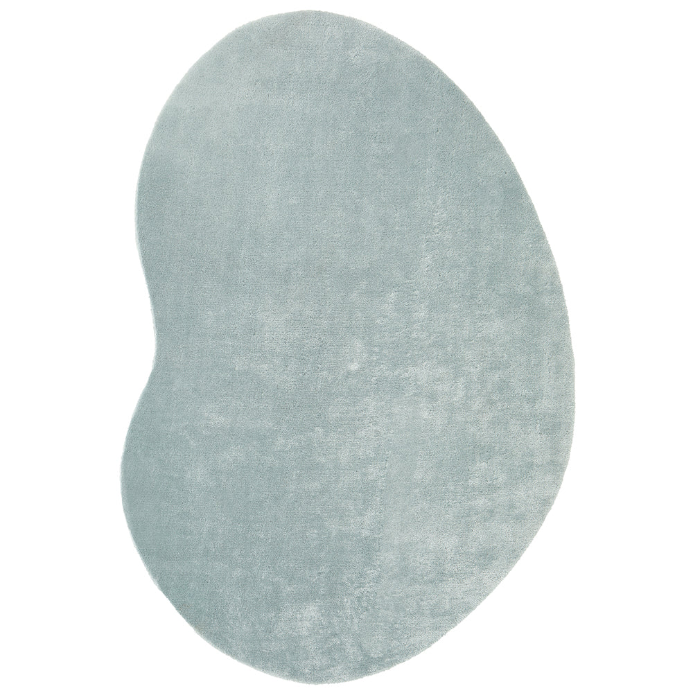 Pale blue irregular-shaped soft modern rug with a subtle textured surface.