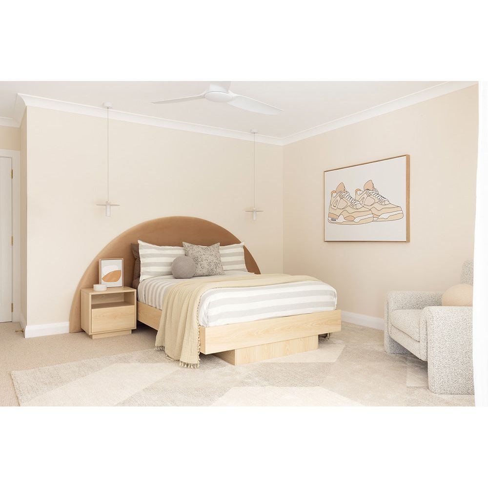 Modern bedroom with wooden bed, nightstands, and a chair.