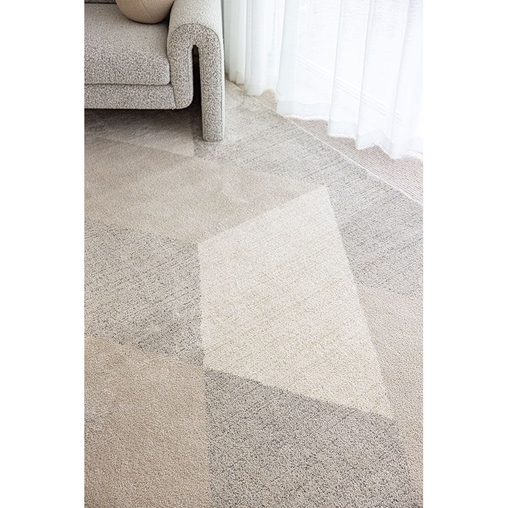 Close-up of a textured gray carpet with a soft focus effect