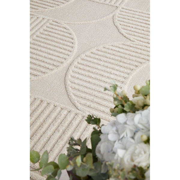 Beige runner rug with modern geometric pattern featuring textured stripes and circles.