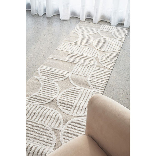 Beige and white runner rug with modern geometric pattern and textured lines on smooth floor.