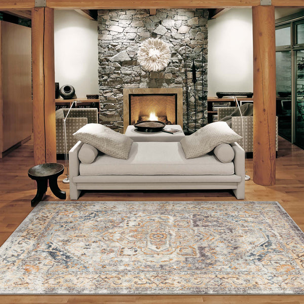 Rectangular blue multi-colored traditional patterned rug with intricate floral and geometric designs on hardwood floor.