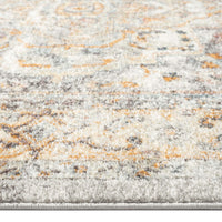 Close-up of blue multi-coloured traditional patterned runner rug with beige and orange accents.