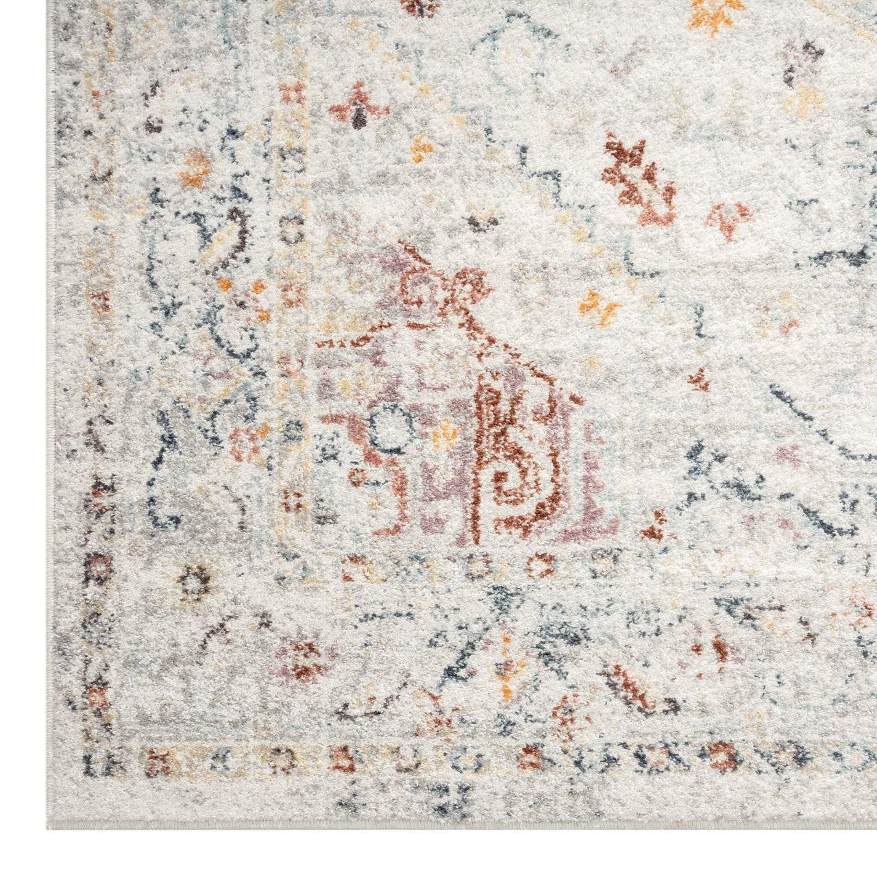 Cream traditional runner rug with faded multi-colored geometric and floral patterns.