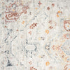 Traditional runner rug with cream background and muted red, orange, blue, and gray intricate patterns.