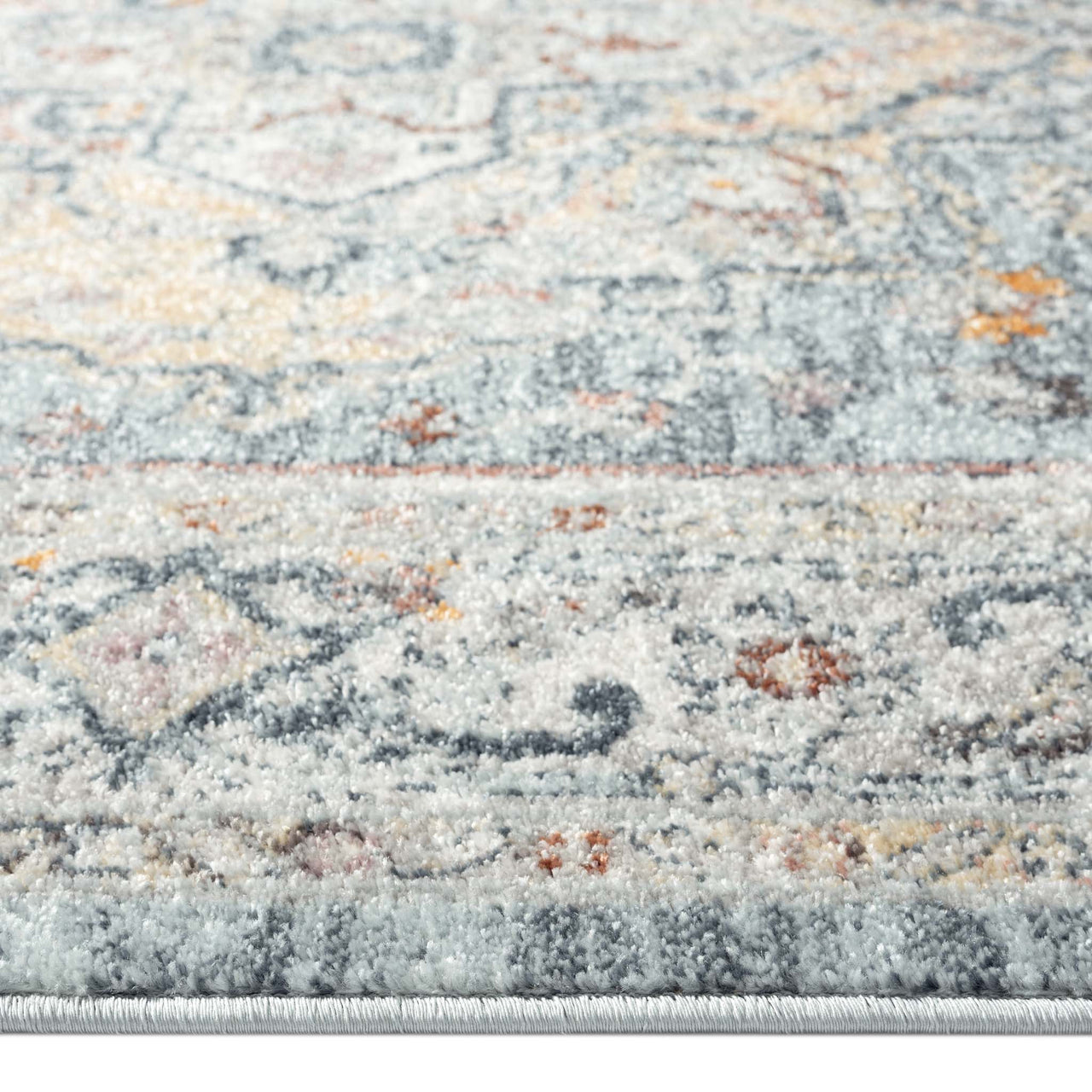 Blue multi-coloured traditional patterned runner rug with intricate geometric and floral motifs in soft pastels.