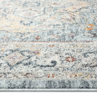 Blue multi-coloured traditional patterned runner rug with intricate geometric and floral motifs in soft pastels.