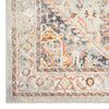 Traditional runner rug with intricate multi-colored patterns in beige, orange, gray, and brown tones.