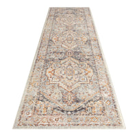 Multi-colored traditional patterned runner rug with beige, orange, and gray tones and intricate geometric designs.