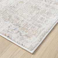 Beige and cream runner rug with textured abstract patterns in muted multi-colors, polyester blend, power-loomed.