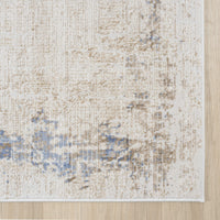 Beige and cream runner rug with textured abstract blue and taupe accents, power-loomed polyester-polypropylene blend.