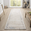 Beige and cream textured abstract runner rug with subtle hints of blue and gray on light wood floor.