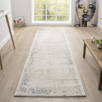 Beige and cream textured abstract runner rug with subtle hints of blue and gray on light wood floor.