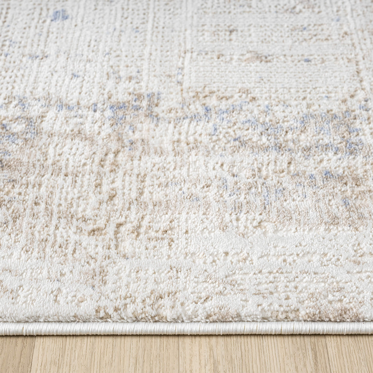 Beige and cream textured abstract runner rug with subtle multi-colored accents and soft pile.