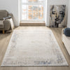 Beige and cream abstract textured rug with subtle blue and gray accents, rectangular shape.