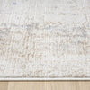 Beige and cream textured rug with subtle abstract patterns and a soft, plush pile.