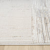 Beige and grey textured runner rug with striped and checkered patterns on wood floor.
