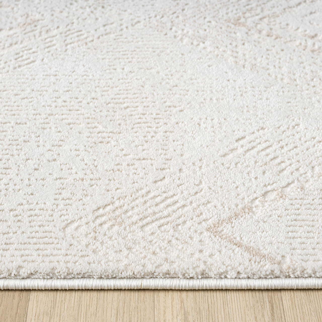 Beige and white modern runner rug with subtle textured abstract pattern on a light background.