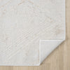Beige and white modern rug with subtle geometric pattern and power-loomed texture on wooden floor.