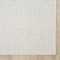 Cream modern runner rug with subtle textured geometric pattern and clean edges on light wood floor.