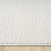Cream runner rug with a subtle textured geometric pattern in a modern style.