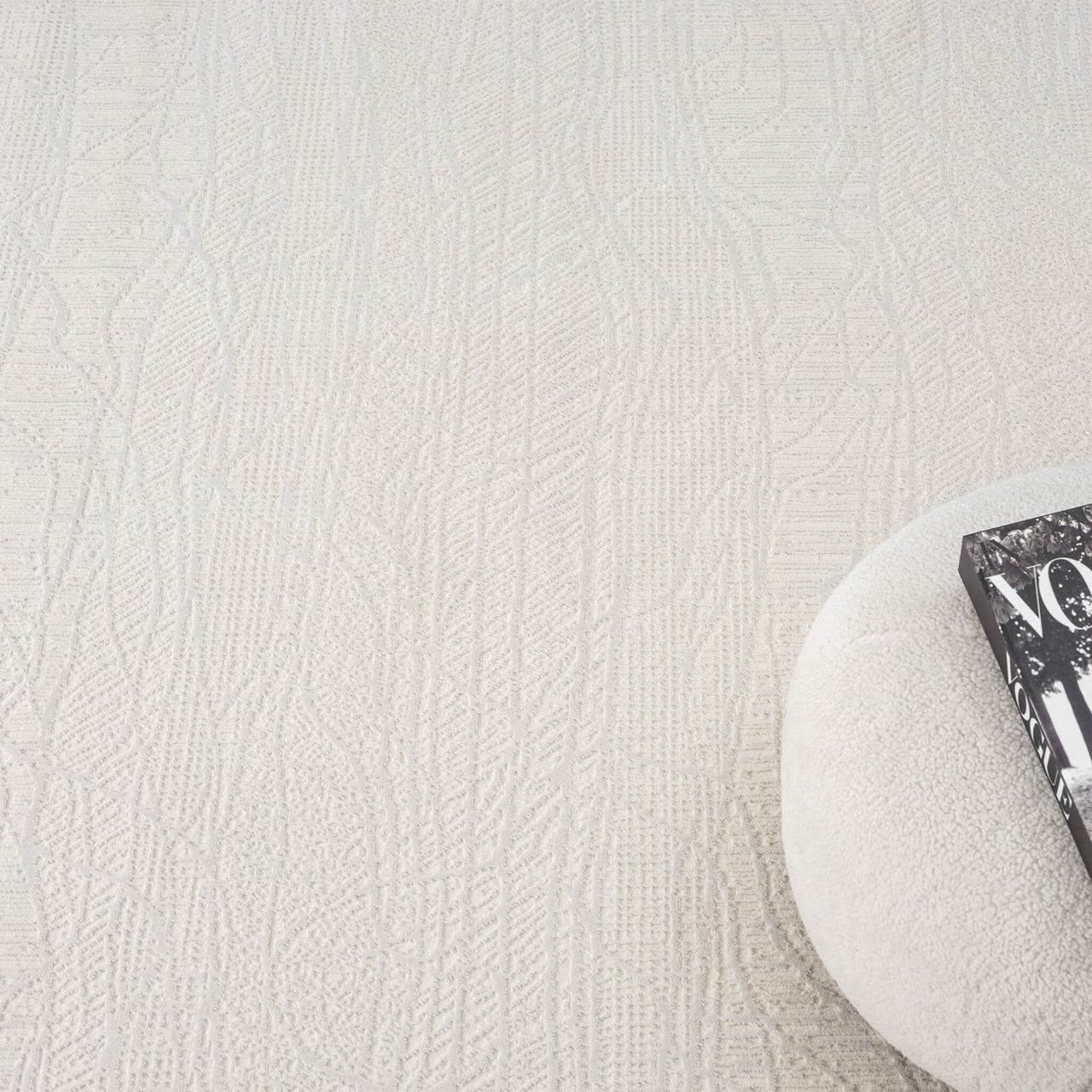 Cream modern rug with subtle textured linear pattern and soft woven surface.