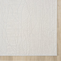 Cream modern rug with subtle geometric pattern and textured weave on light wood floor.