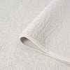 Cream modern rug with subtle geometric textured pattern, soft polyester-polypropylene blend.