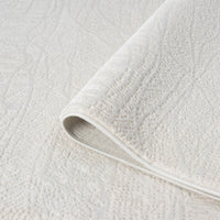 Cream modern rug with subtle geometric textured pattern, soft polyester-polypropylene blend.