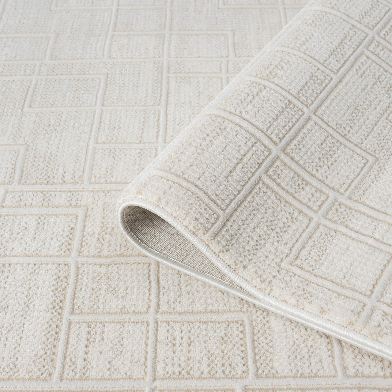 Cream modern runner rug with textured geometric square pattern and plush pile.