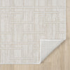 Cream modern runner rug with geometric square pattern and textured weave on light wood floor, corner folded to show backing.