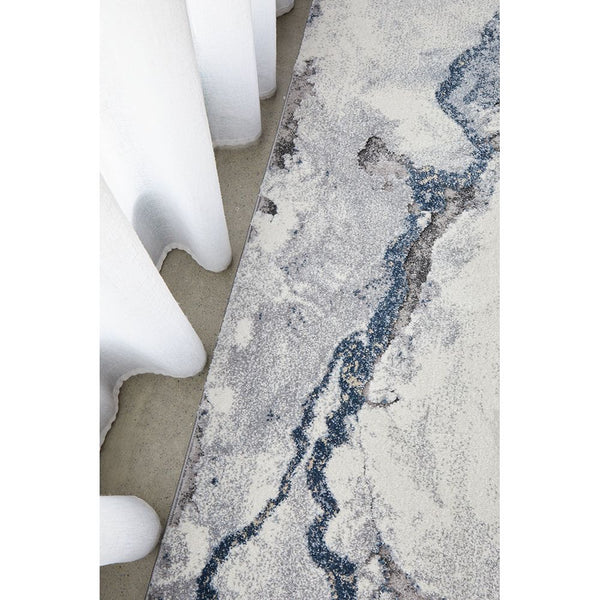 Textured area rug with wavy pattern on a neutral background