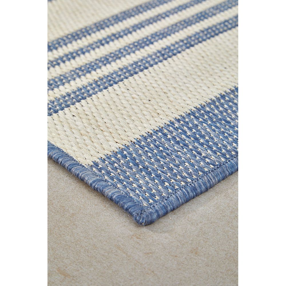 Close-up of a blue and white striped rug.