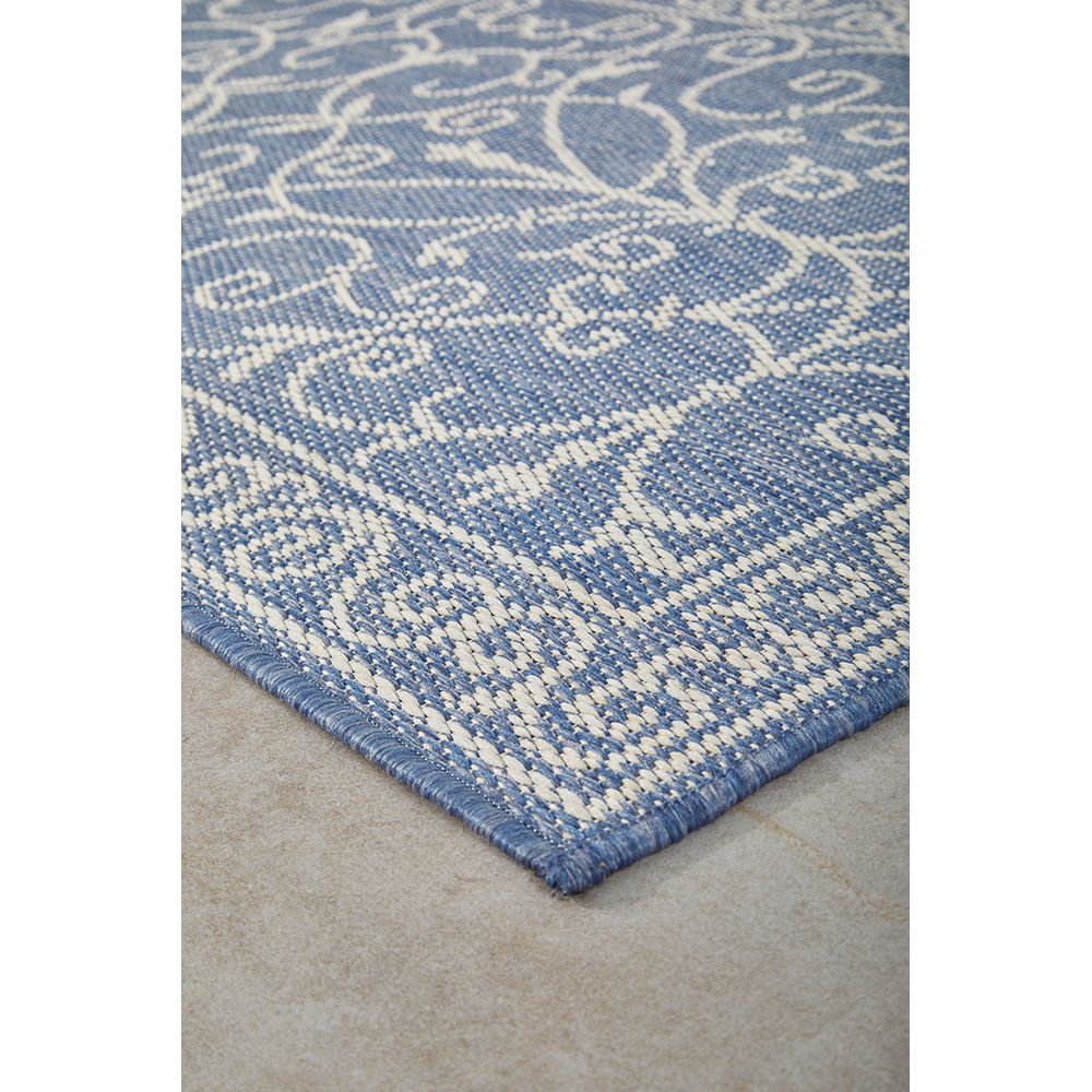 Blue and white patterned outdoor runner rug