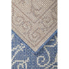 Runner rug with geometric pattern transitioning from beige to blue