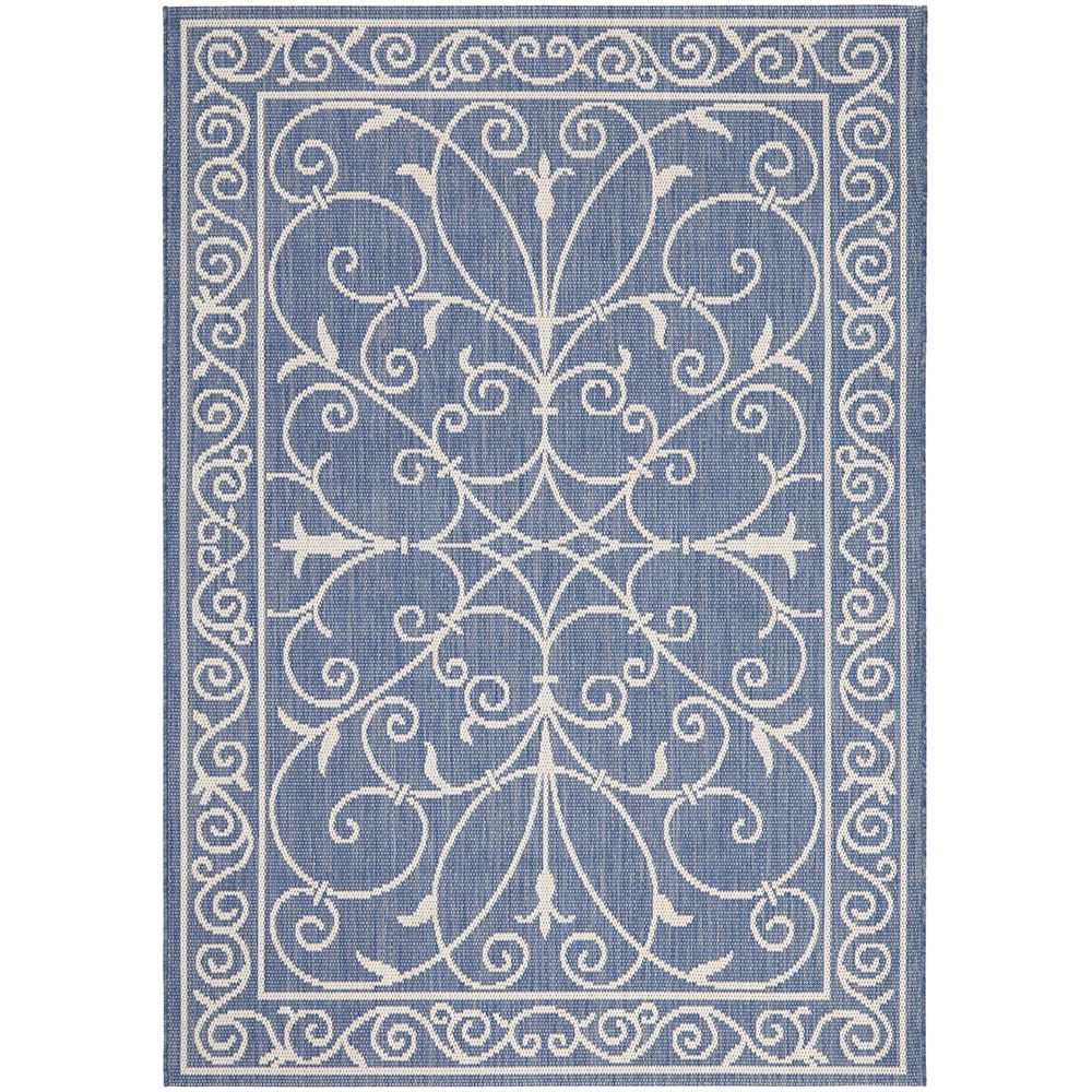 Decorative blue and white indoor outdoor rug with intricate patterns.