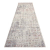 Beige runner rug with multi-colored abstract pattern and subtle textured details.