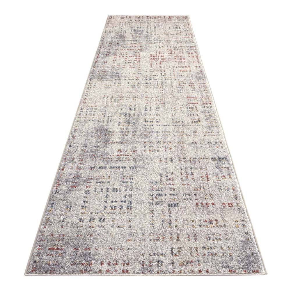 Beige runner rug with multi-colored abstract pattern and subtle textured details.