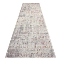 Beige runner rug with multi-colored abstract pattern and subtle textured details.
