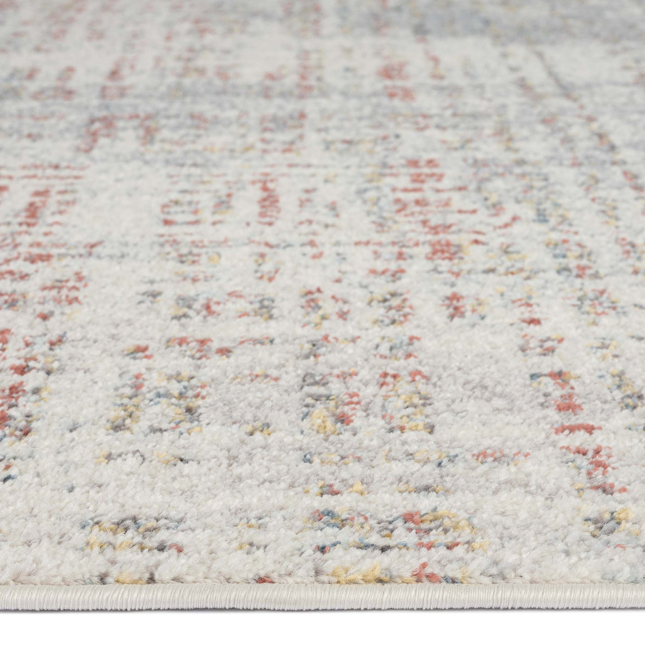 Beige rug with subtle abstract lines and soft multi-colored specks in muted tones.