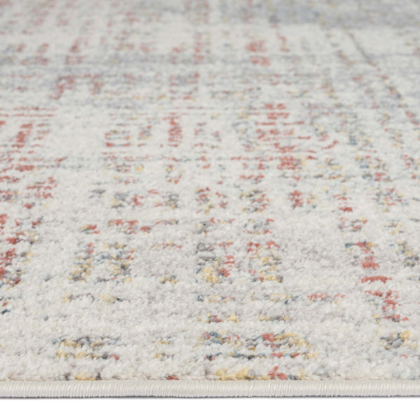 Beige runner rug with soft abstract pattern in muted red, yellow, and gray tones.