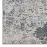 Grey multi-coloured abstract patterned rug with textured, modern design.