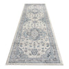 Blue and beige transitional patterned runner rug with intricate floral motifs and medallions.
