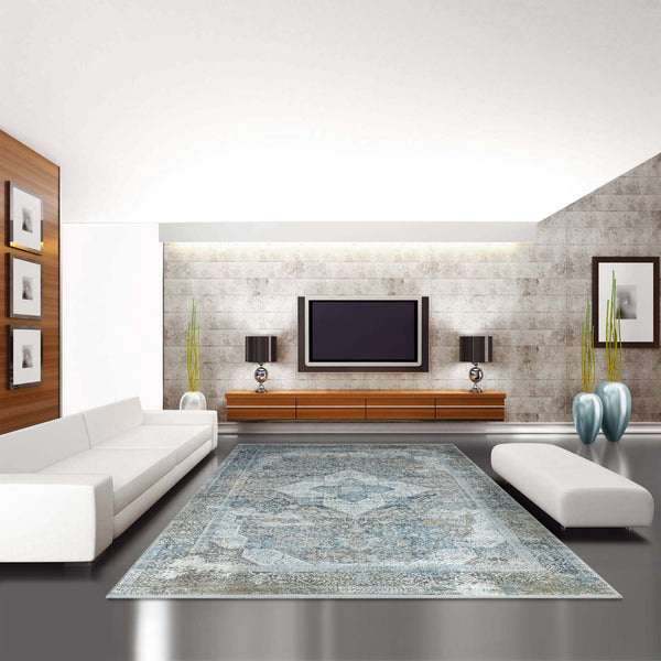 Grey blue patterned transitional rug with intricate design, placed in modern living room with white furniture and wooden.